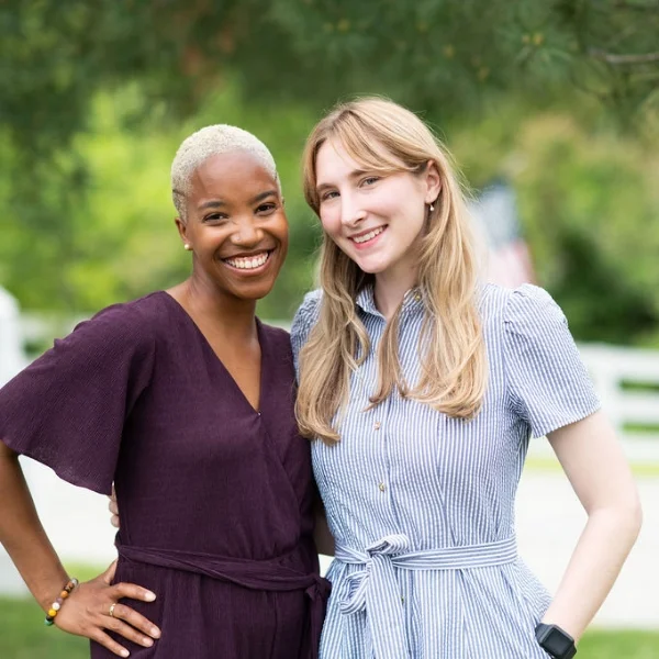 2 female Keswick employees smiling